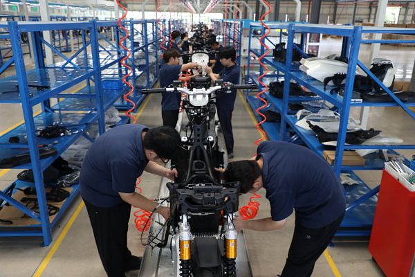 page-1-1 Electric motorcycle frame assembly line at SIEKON factory
